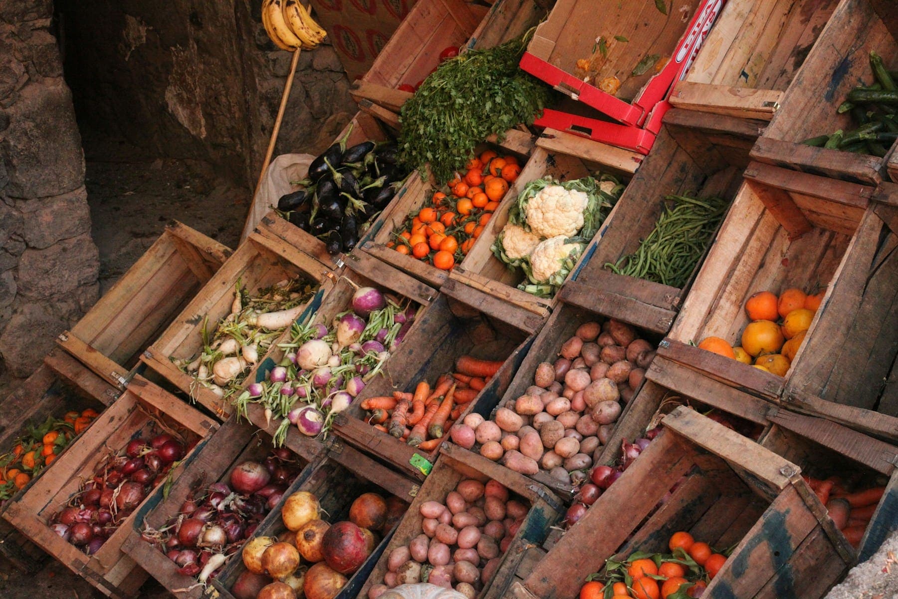 Wooden crates of assorted fresh vegetables