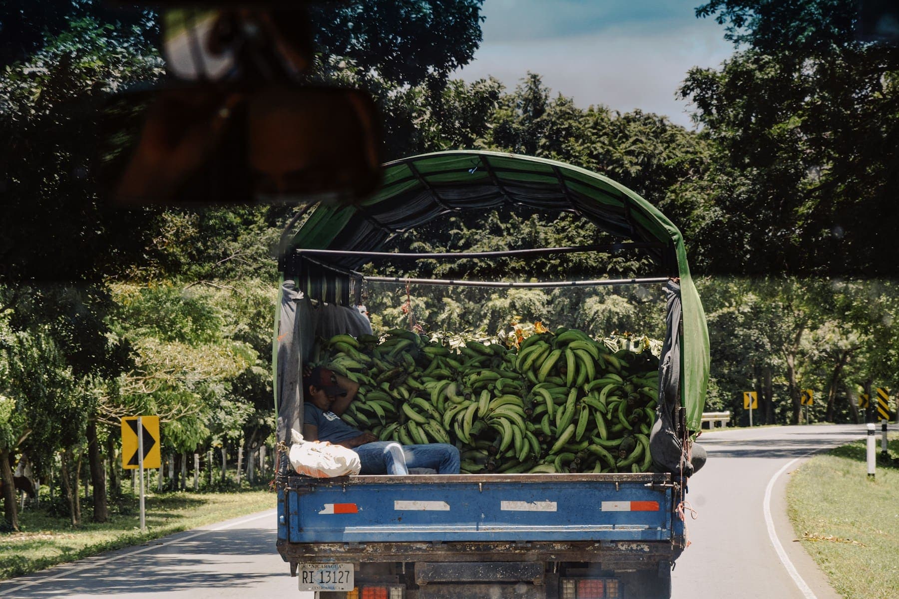 A truck loaded with fresh plantain on a rural road