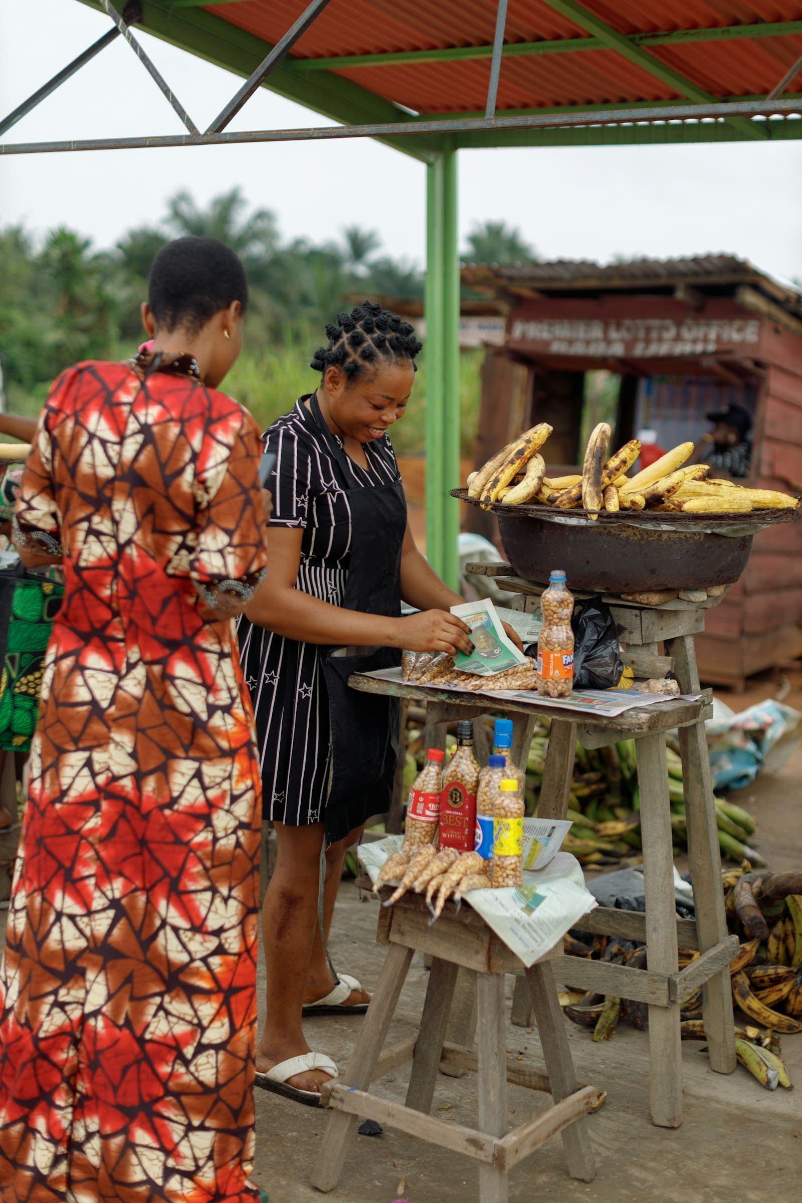 Traders selling fresh plantain at a roadside stall